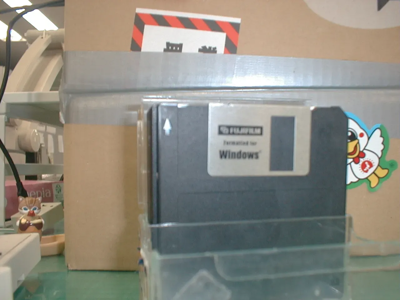 A messy desk with camera equipment